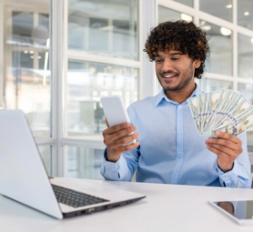 young-businessman-celebrating-financial-success-office_321831-21990
